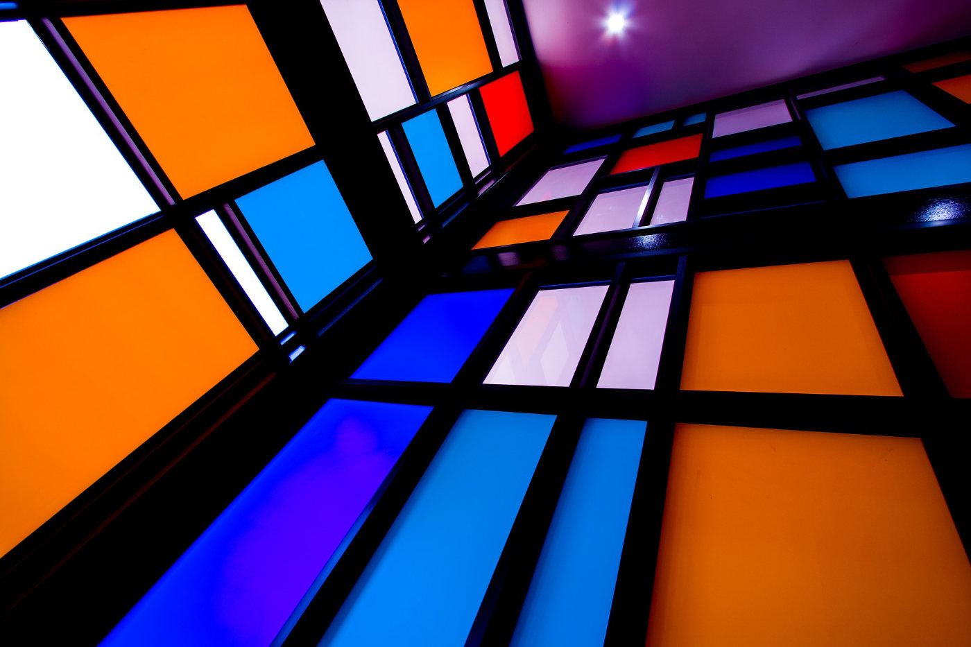 Coloured Mondrian-style glass in blues & orange in black frames